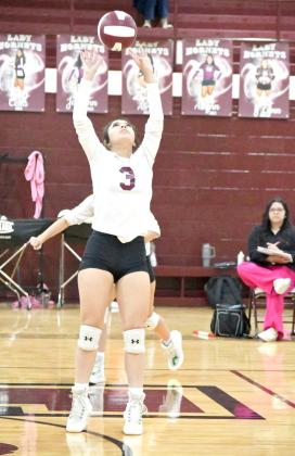 Junior, Bri Valdez, sets a ball up for a team mate, as Littlefield looked to go on the attack, during set two, of their, 3-2, victory over Tulia on Tuesday night. (Staff Photo by Derek Lopez)
