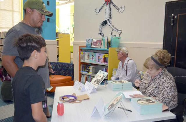 SHELLIE “SHELCO” COLES (right) signed her children’s book, “Meet Stunkey the Monkey and his Twin Sister Spunkey” on Thursday, Oct. 13, 2022 at the Lamb County Library. Children and parents from all over Littlefield came to meet Coles, purchase a signed copy of her book. (Photo by Samantha Pontius)