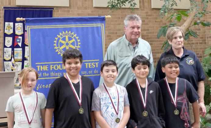The Rotary Readers of Littlefield Elementary received their medals at theReaders, Writers, and Reasoners awards ceremony held at the atrium of Lamb Healthcare Center on Thursday, April 25, 2024. They are Amelia Thomas, Noah Silva, Damian Mata Liam Rodriguez, and Zalariah Carrasco with John Roley and Kay King. (Photo by Ann Reagan)