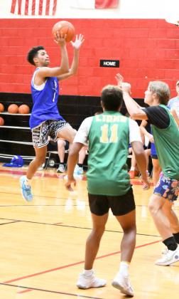 Olton guard, Sebasian Sparkman goes up for a floater in the lane, during the second half of the Mustang’s, 44-25, victory over New Deal at the New Home Team Camp on Friday. (Staff Photo by Derek Lopez)