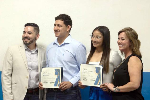 Scholarship recipients America Pacheco and Kevin Garcia Torres pose with Chamber of Commerce members Oscar Gonzalez and Brande Perkins at the Amherst Chamber Banquet on April 10, 2025. (Staff Photo by Madison Vidales)