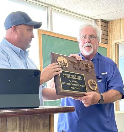 Mike West was presented with a plaque commemorating his 42 years of service at Springlake-Earth Cotton Growers, during his Retirement luncheon on July 31st. (Submitted Photo)