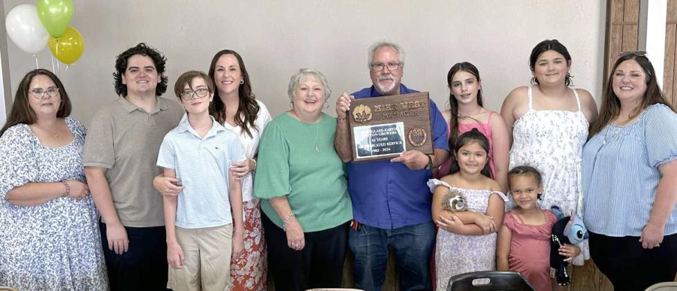 Mike West, Manger of Springlake-Earth Cotton Growers, retired on July 31st after 42 years of service. He was joined at his retirement luncheon by several members of his family (L-R): Keta West, daughter; Taegan Everett, grandson; Oliver Whitney, grandson; Keri Whitney, daughter; Kathy West, wife; Mike West; London Whitney, grandaughter; Kynlee Pauda, grandaughter; Khloe Pauda, grandaughter; Amara Dyck, grandaughter and Krista Pauda, daughter. (Submitted Photo)