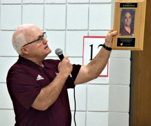 Littlefield Independent School District Superintendent, Mike Read, shares the inscription on the Plaque dedicated to honored employee, Marcelino Garcia, Sr. (Photo by Ann Reagan)