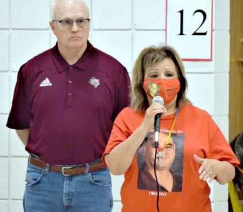 Mrs. Marcelino Garcia, Sr., right, addresses the attendees at the Plaque dedication ceremony that was held on Friday, Oct. 8th honoring her husband, Marcelino Garcia, Sr. LISD Superintendent Mike Read, listens as Mrs. Garcia speaks on behalf of her husband. (Photo by Ann Reagan)