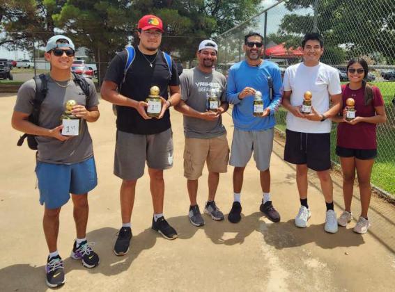 Jeremiah Salazar and Jayden Longoria (left) took first place in the Pickleball Tournament at the 2024 Amherst Summer Celebration that took place last Saturday. Javier Garza and JG (Middle) took second place in the tournament and Gabe Garza and Monica Elizondo (Right) took third place. (Photo by Ann Reagan)
