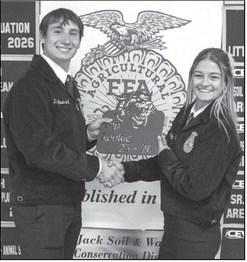Tate Clark presents the Top Rookie Award to Mattie Seymore at the Littlefield FFA banquet on May 18, 2026.