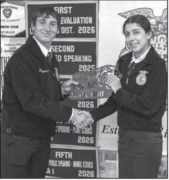 Tate Clark presents Tayte Miller with the Top Senior Showman award at the Littlefield FFA banquet on May 18, 2026.