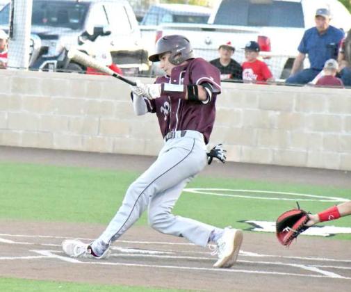 BOMBS AWAY - Littlefield’s, Adam MacDonald, launches a shot that one-hopped to the left field fence, during the top of the third inning of the Wildcats, 19-1, game one victory over Stanton in their Bi-district play-off series in Lamesa this past weekend. (Staff Photo by Derek Lopez)