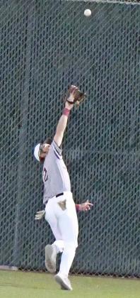 Littlefield senior, Major McNeese, retreats towards the fence in center field and makes a catch for out number two in the top of the third inning of the Wildcats’ victory over Sundown on Monday at Wildcat Field. (Staff Photo by Derek Lopez)