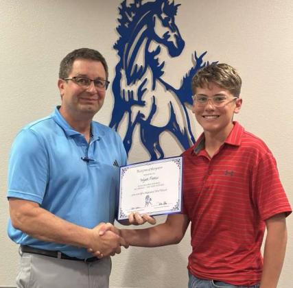 Tullie Struve, School Board President, left, awards Wyatt Francis, right, Olton Mustang Baseball All District - 2nd Team Outfield. (Submitted Photo)