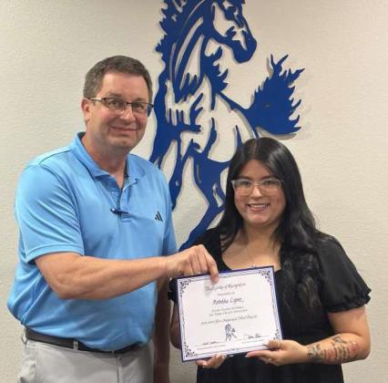 Tullie Struve, School Board President, left, awards Rebekka Lopez, right, Olton Fillies Softball - 1st Team Utility Infielder. (Submitted Photo)