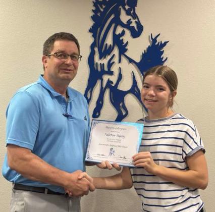 Tullie Struve, School Board President, left, awards HalleKate Huguley, right, Olton Fillie Tennis Regional Qualifier. (Submitted Photo)