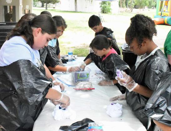 A group of kids at the Lamb County Leaf Day Camp got to make tiedye shirts on Tuesday, during day one of the two-day camp. (Staff Photo by Derek Lopez)