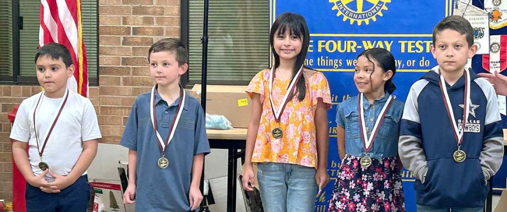 ROTARY READERS from third grade at Littlefield Elementary School, were honored for the improvement in their classes for the fourth six weeks. They are, left to right, Jonathan Kidd, Ms. Miller, Taos Duncan, Ms. Kloiber; Mikaela Rico, Ms. Jones; Lydia Leal, Mrs. Johnson; and Brayden Aleman, Ms. Adkins. Rotary President, Kay King, presented the award medals. (Rotary Photo)
