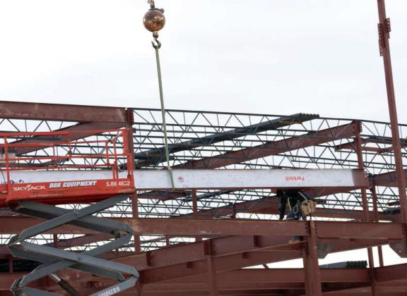 One of the signed beams is shown being installed in the new construction at Littlefield High School on Friday, November 17, 2023, after the steel signing that was held at the construction site. (Photo by Ann Reagan)