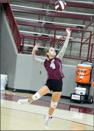 DELIVERING THE SERVE - Littlefield’s Kamryn Jimenez leaps up to deliver the jump serve, during the first set of the Lady Cats match with Dimmitt on Tuesday, as part of a dual. The Lady Cats won the match, 2-0. (Staff Photo by Derek Lopez)