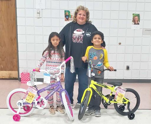 PERFECT ATTENDANCE BIKE WINNERS - Friday, Dec. 16, Primary Principal Staci Sumners drew winners for the perfect attendance bikes for the first semester. The winners were 2nd grader, Zariah Gomez and first grader, Israel Fernandez. The Bikes were donated by the Littlefield Rotary Club. (Staff Photo by Derek Lopez)