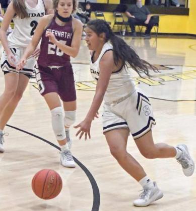 DRIVING TO THE BASKET - Sudan junior, Liz Sital, puts the ball on the floor, as she drives the left side of the basket, looking to score, during the second half of the Nettes’ overtime loss to Abernathy on Tuesday, 63-55. (Staff Photo by Derek Lopez)