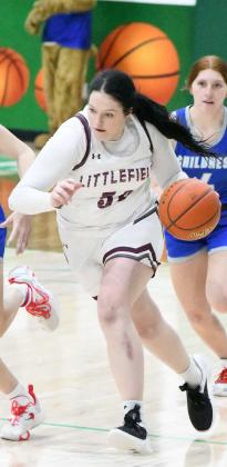 BRINGING THE BALL DOWN - Littlefield junior, Kyndal Edgemon, brings the ball down court in transiton, as the Lady Cats look to get out on the break, during the first half of the Lady Cats 3AArea loss to Childress on Thursday in Floydada. (Staff Photo by Derek Lopez)