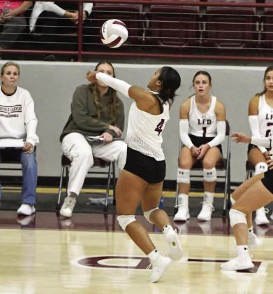 Littlefield’s Brittani Wright saves a ball on the sideline, as the Lady Cats look to go on the attack, during the third set of the Lady Cats, 3-1, district victory over Tulia on Tuesday for Senior Night. (Staff Photo by Derek Lopez)