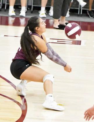 Littlefield’s Alyssa Torres digs out a ball during the first set of the Lady Cats’ district match-up with Shallowater on Tuesday at Wildcat Gym. (Staff Photo by Derek Lopez)