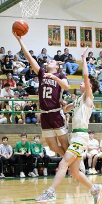 Littlefield’s Chip Green gets to the rack for a lay-up, during the first half of the Wildcats’ road victory over Idalou on Friday. (Staff Photo by Derek Lopez)