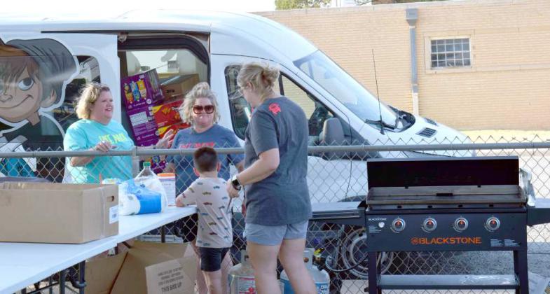 KINGDOM COME MINISTRIES of Lubbock partners with Littlefield Primary School to promote family, friendships and education in a Christian manner by providing food and water as well as serving the hot dogs they provide for the Back to School Cookout Social held on Monday, August 21, 2-23. The ladies serving for Kingdom Ministries were Kristin Montgomery, Leslie Roach, Natalie Roach and Brenna Day. (Photo by Ann Reagan) Helmets with Heros