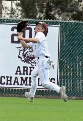 NO FLY ZONE - Littlefield center fielder, Major McNeese, tracks down a fly ball hit into deep left-center field, during the Wildcats, 3-0, loss to Bushland on Tuesday at Wildcat Field. (Staff Photo by Derek Lopez)