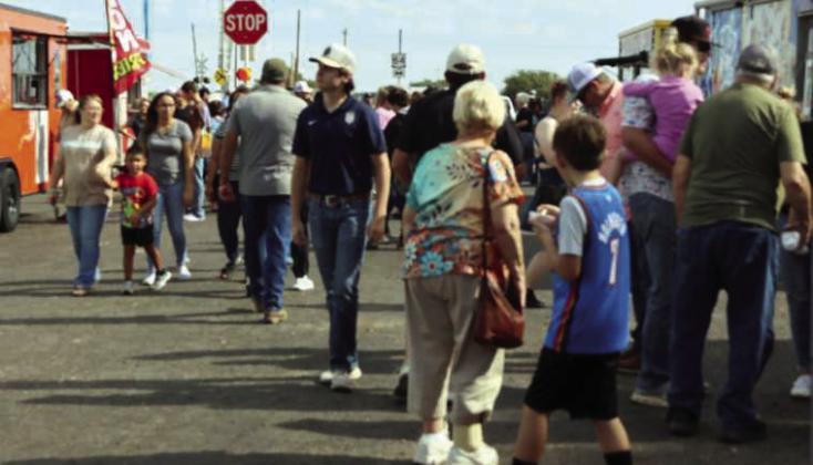 Parade attendees head to the Sudan Park activities and food vendors following the Sudan Harvest Festival Parade on Saturday, Sept. 27, 2025. (Photo by Ann Reagan)