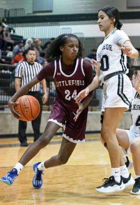 Littlefield freshman, Amoni Jefferson, drives to the basket looking for a bucket, during the first half of the Lady Cats’ victory over Muleshoe on the road on Friday afternoon. (Staff Photo by Derek Lopez)