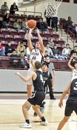 FINISHINGAT THE RIM —Littlefield senior forward, Chris Brown (44), puts up a baby hook over the Muleshoe defense, during the first half of the Wildcats, 44-21, victory over the Muleshoe Mules at Wildcat Gym on Tuesday. (Staff Photo by Derek Lopez)
