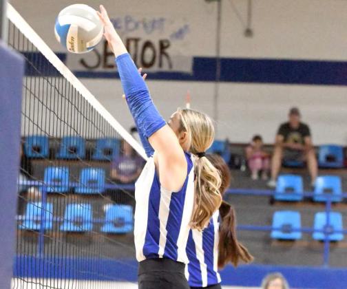 Olton’s Taryn Smith goes up and deliveres a block at the net, during the first set of the Fillies’ 3-2 victory over Talkington at home on Tuesday. (Staff Photo by Derek Lopez)