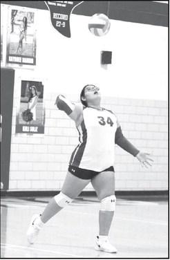 Olton’s Allison Rivera puts the ball in play with a serve, during the second set of the Fillies, 3-2, victory over Talkington at home on Tuesday. (Staff Photo by Derek Lopez)