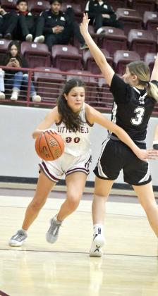 Littlefield junior, Ari Castillo (30), gets around a Muleshoe defender on the baseline, as she gets to the bucket for two of her 21 points in Friday’s district victory over Muleshoe, 64-31. (Staff Photo by Derek Lopez)
