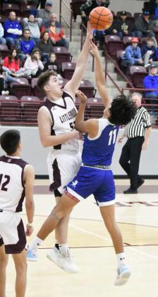 PROTECTING THE RIM – Littlefield forward, Zeke Saenz (52), sends back a shot attempt in the lane by Olton’s Nathan Urbina (11), during the Mustangs’ Wildcat Classic semi-final victory over the host team Wildcats in overtime on Wednesday, 63-60. (Staff Photo by Derek Lopez)