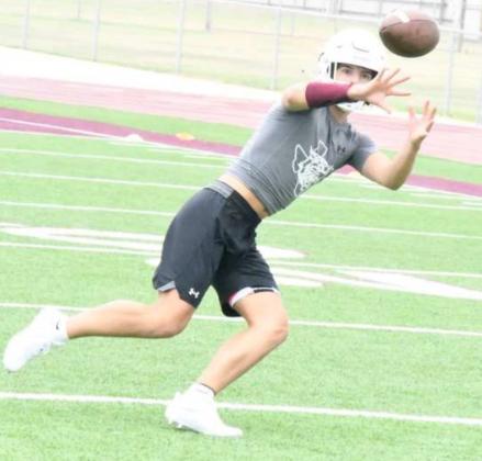 NICE CATCH – Littlefield’s Brady Jones makes a nice catch during route running drills, during the Wildcats’ first day of two-a-days on Monday. (Staff Photo by Derek Lopez)