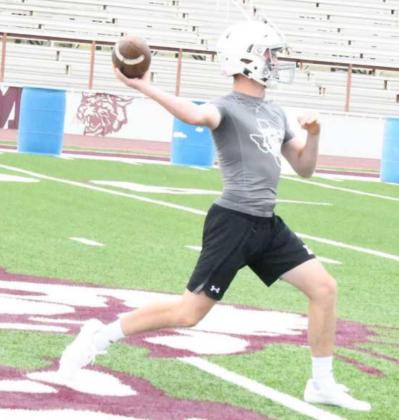 GETTING BETTER – Littlefield’s Chip Green runs the scout team offense, as the first-team defense works on coverage and getting to the ball, during the Wildcats’ first day of two-a-days on Monday. (Staff Photo by Derek Lopez)