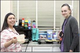 Lamb County Librarian, Selena Sanchez and her assistant, Abby Tuchek were preparing pancakes and sausages for guests at the Lamb County Library Pajama Party on Thursday January 30, 2025. (Photo by Ann Reagan)