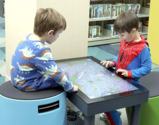 These two young gentlemen were engrossed in a video game at the Lamb County Library pajama party on Thursday January 30, 2025. (Photo by Ann Reagan)