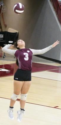 SENDING THE SERVE – Littlefield’s Bri Valdez leaps up to deliver the jump serve, during the Lady Cat’s first set with the Estacado Lady Matadors on Tuesday at Wildcat Gym in Littlefield. (Staff Photo by Derek Lopez)