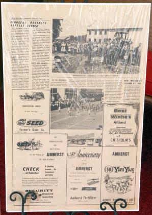 THE 50TH ANNIVERSARY page from The Amherst Press dated 1973 was displayed during the Centennial Celebration of the First Baptist Church of Amherst. (Photo by Ann Reagan)