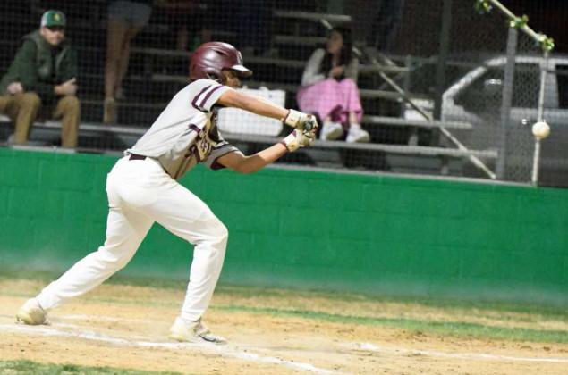 Littlefield senior, Gabriel Villanueva, lays a bunt down on the third base side and beats it out to give Littlefield a base runner in the top of the sixth inning, of their, 8-7, loss to Idalou in their district-opener on Tuesday. (Staff Photo by Derek Lopez)
