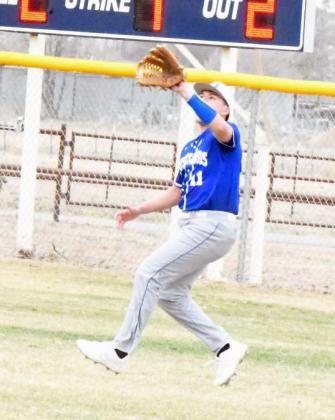 Olton’s Alan Vasquez catches a fly ball in right field for an out, during the Mustang’s Lamb County Classic-opener against Ropes on Thursday morning. (Staff Photo by Derek Lopez)
