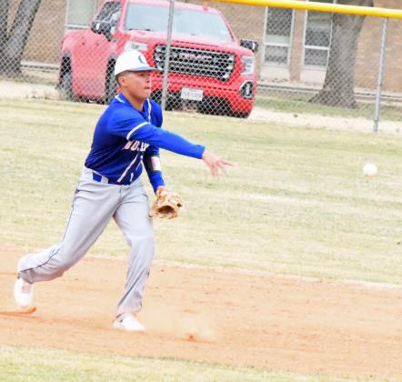Olton’s Paytn Jimenez fields a ground ball at shortstop and flips it to Jett Tomsu at second base for an out, during the Mustang’s Lamb County Classic-opener against Ropes on Thursday morning. (Staff Photo by Derek Lopez)