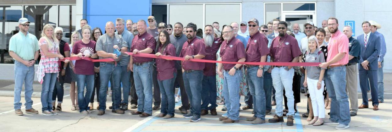 Representatives of the Littlefield Chamber of Commerce and area representatives of the General Motors group of Dealerships along with Littlefield residents were present for the Ribbon Cutting ceremony welcoming the new owner of Littlefield Chevrolet Buick and GMC, Tim Capps to the Littlefield community. (Photo by Ann Reagan)