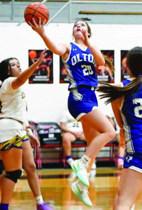 Olton’s Jentry Bressler (20), drives the right side and gets into the paint for a lay-up, during the first half of the Fillies’, 73-26, victory over Crosbyton in their tournament- opener at the Whitharral Invitational. (Staff Photo by Derek Lopez)