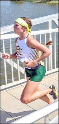 CROSS THE BRIDGE - Springlake-Earth senior, Taytum Goodman, crosses the bridge on her to a first-place finish in Lubbock on Saturday, clocking a time of 12:05. (Submitted Photo)