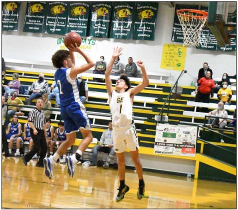 STOPAND POP-Olton sophomore guard, Jake Soliz (2), pulls up and knocks down a jumper in the lane over Springlake-Earth’s, Evan DeLeon (1), during the Mustangs’, 85-58, victory over the Wolverines on the road. (Staff Photo by Derek Lopez)