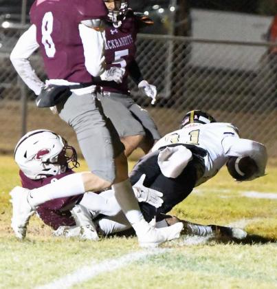 Sudan running back, Angel Martinez, stretches the ball across the goal line for a touchdown, during the second quarter of the Hornets district victory over Ralls on the road on Friday. (Staff Photo by Derek Lopez)